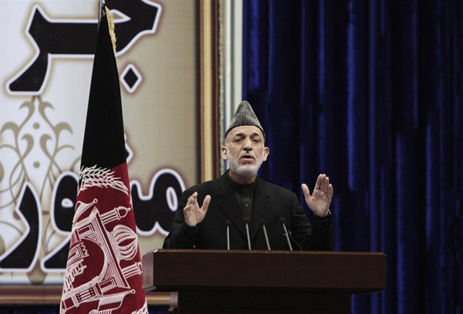Afghan President Hamid Karzai speaks during the first day of the Loya Jirga in Kabul, Afghanistan, Thursday, Nov. 21, 2013.