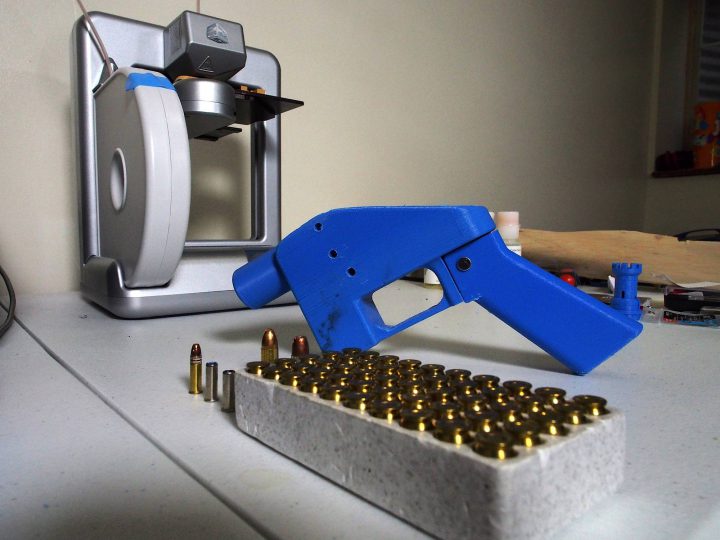A Liberator pistol appears on July 11, 2013, next to the 3D printer on which its components were made.