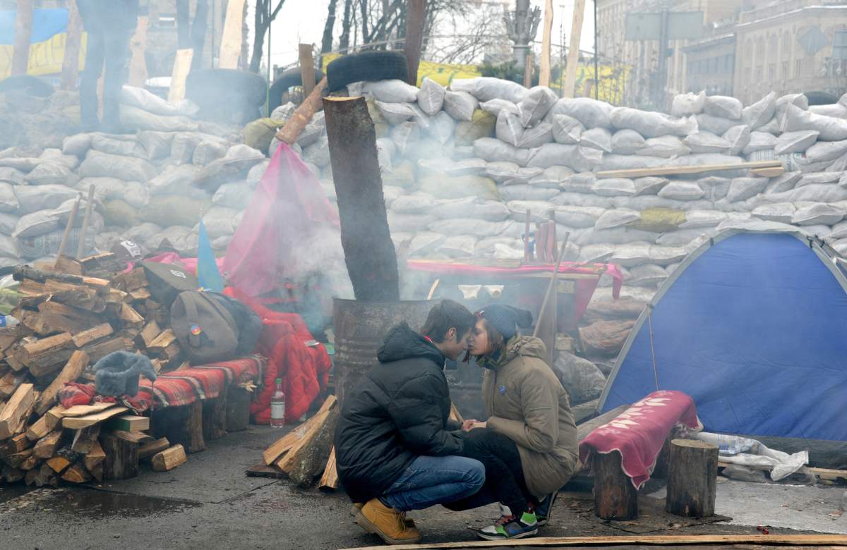 Young protesters wait at the barricade on Independence Square in Kiev on December 13, 2013. (Viktor Drachev, AFP/Getty Images)