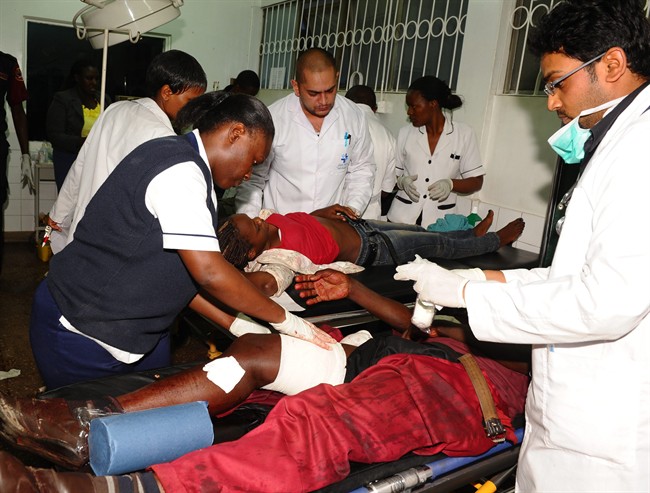  Injured people are treated at Guru Nanak Hospital in Nairobi, Kenya, after a device exploded inside a passenger van, Saturday, Dec. 14, 2013. 