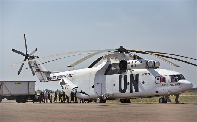 In this FILE photo, a United Nations helicopter offloads supplies at the airport, to be taken to a nearby U.N. camp where the displaced have sought shelter, in Malakal, South Sudan Monday, Dec. 30, 2013.