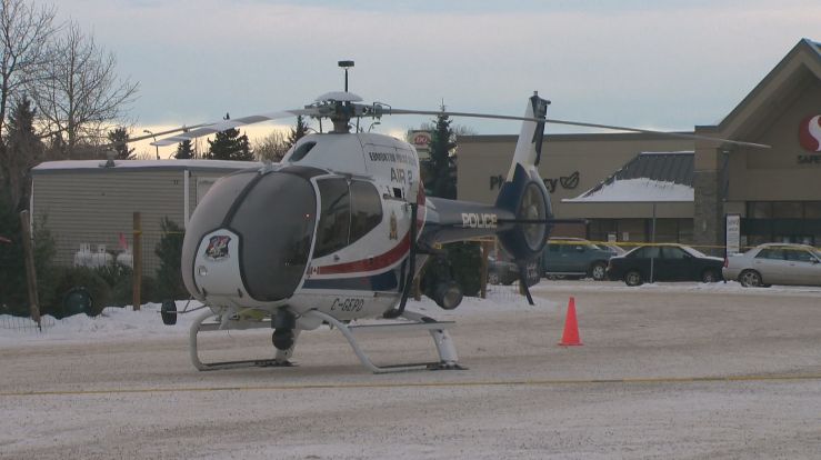 Edmonton police chopper forced to land in west Edmonton parking lot because of freezing rain, Monday, December 23, 2013. 