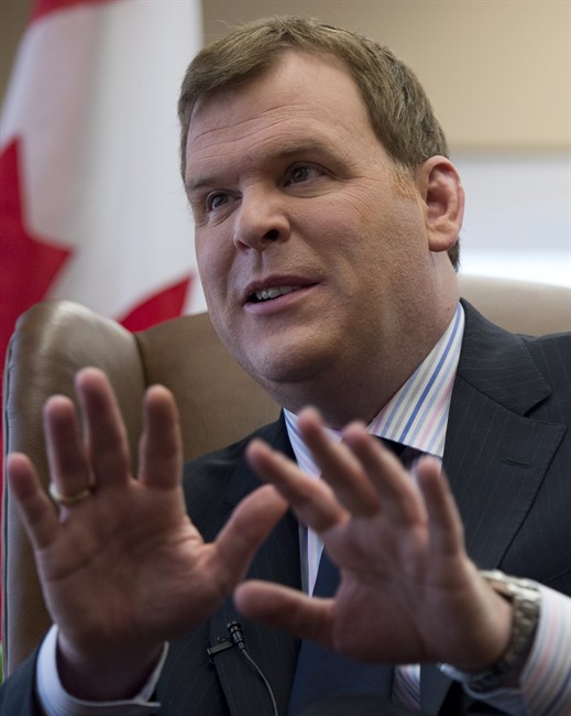 Foreign Affairs Minister John Baird is seen during an interview with The Canadian Press at his office Wednesday December 18, 2013 in Ottawa. THE CANADIAN PRESS/Adrian Wyld.