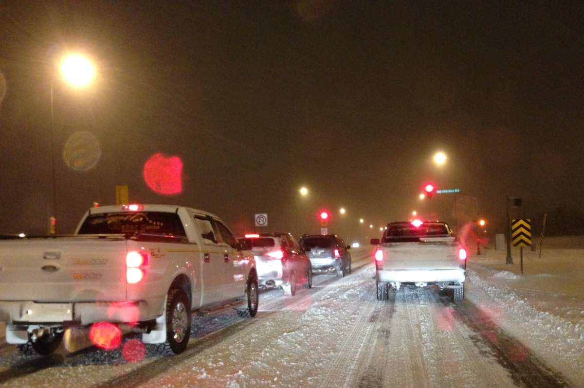 Traffic was slow at westbound Bishop Grandin Boulevard near Lakewood Boulevard on Wednesday evening. By morning, 12-15 centimetres of snow had accumulated.