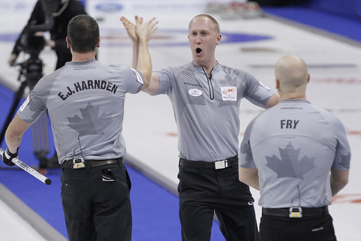 Skip Brad Jacobs, second E.J. Harnden and third Ryan Fry celebrate their win over Kevin Martin in draw 13 at the 2013 Roar Of The Rings championship in Winnipeg on Thursday.