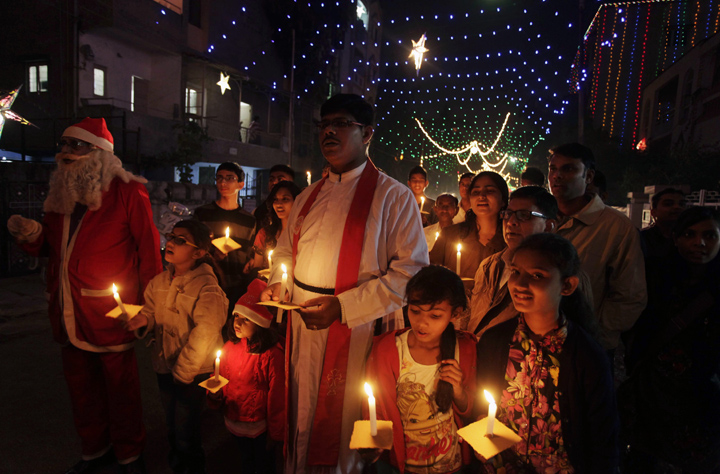 Indian Christians hold candles ahead of Christmas in Ahmadabad, India, Tuesday, Dec. 24, 2013. Though Hindus and Muslims comprise the majority of the population in India, Christmas is celebrated with much fanfare.