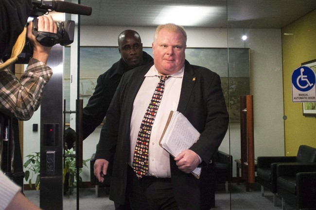 Mayor Rob Ford arrives at city hall in Toronto on Tuesday, November 19, 2013.