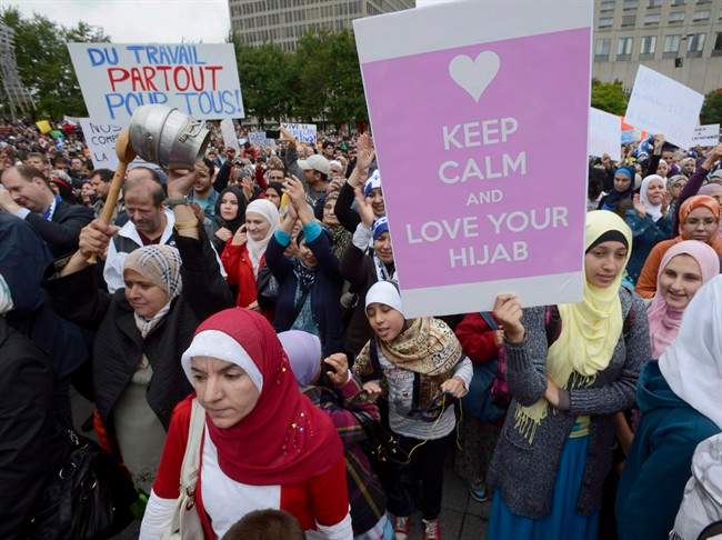 Demonstrators take part in a protest against Quebec's proposed Values Charter in Montreal on Sept. 14, 2013. 