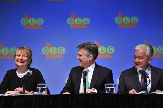 OLG's President and CEO Rod Phillips (centre) and Mike Hamel, OLG's Director of Corporate Investigations