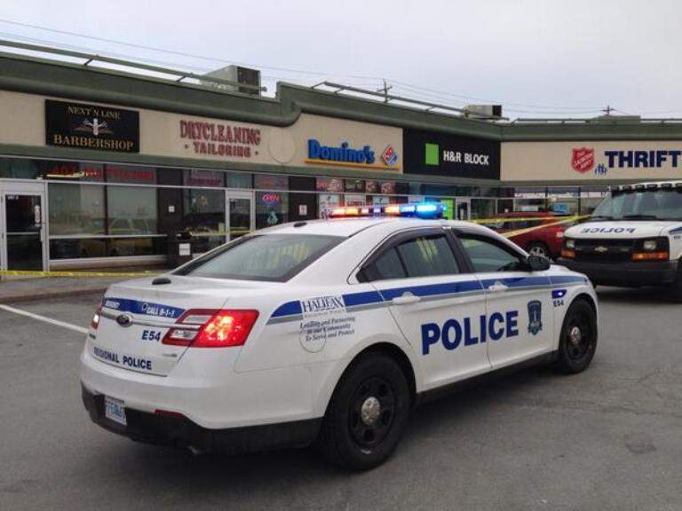  Halifax police seized a weapon and arrested a man Tuesday after someone fired a series of shots inside a barbershop in Dartmouth.