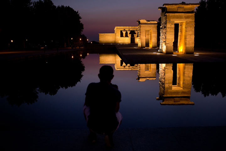 A young man enjoys Debod Egyptian Temple at sunset on August 23, 2013 in Madrid, Spain. (Photo by Gonzalo Arroyo Moreno/Getty Images)