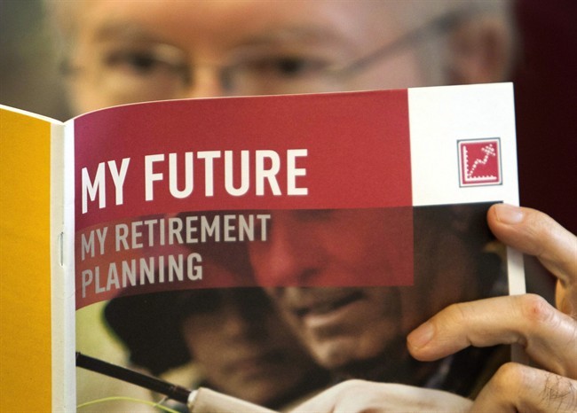 A man looks over retirement savings options February 3, 2012 in Montreal. THE CANADIAN PRESS/Ryan Remiorz