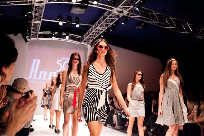 Models walk the runway at the winter edition of Montreal Fashion Week in this undated handout photo.