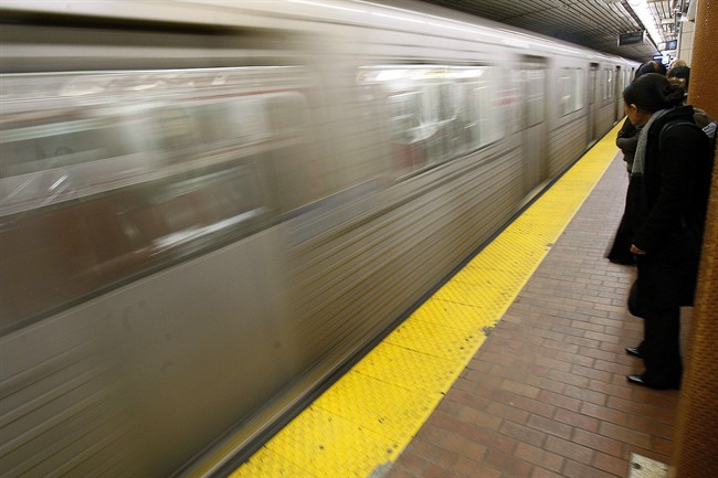Commuters wait on the subway platform at Toronto's Union Station on March 4, 2008.
