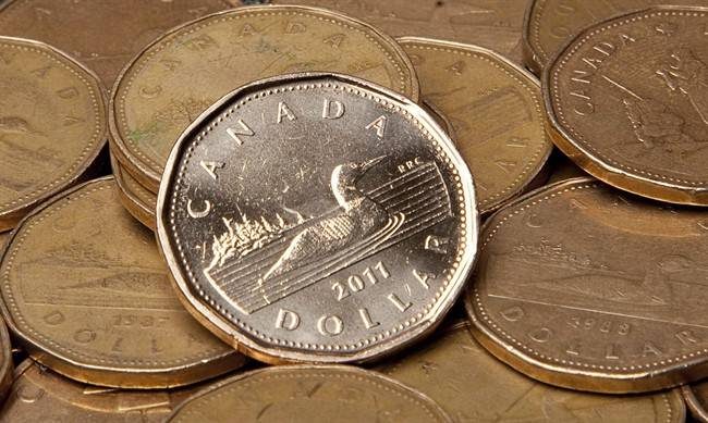 File: Canadian dollars are pictured in Vancouver, Sept. 22, 2011.