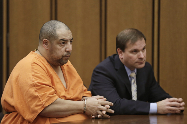 Elias Acevedo, left, looks toward the judge during his pretrial hearing Monday, Dec. 2, 2013, in Cleveland. 