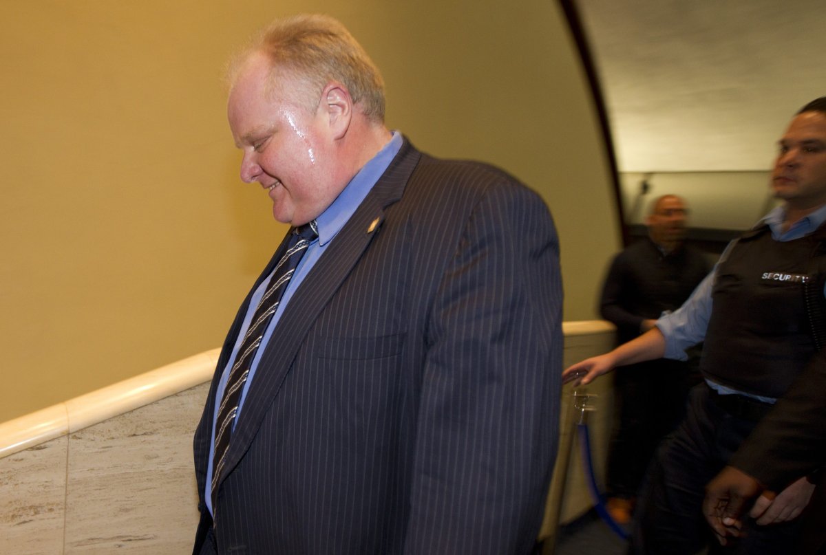 Mayor Rob Ford walks away after a press conference with his budget chief Frank DiGiorgio at Toronto City Hall on Dec. 10, 2013. 