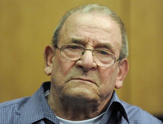 FILE - In this Oct. 28, 2009 file photo Heinrich Boere, a former member of Adolf Hitler's Waffen SS, sits in the dock of a court at the start of his trial in Aachen, Germany. German justice officials said Monday, Dec. 2, 2013 Heinrich Boere, who murdered Dutch civilians as part of a Nazi Waffen SS hit squad during World War II but avoided justice for six decades, has died in a prison hospital. He was 92.