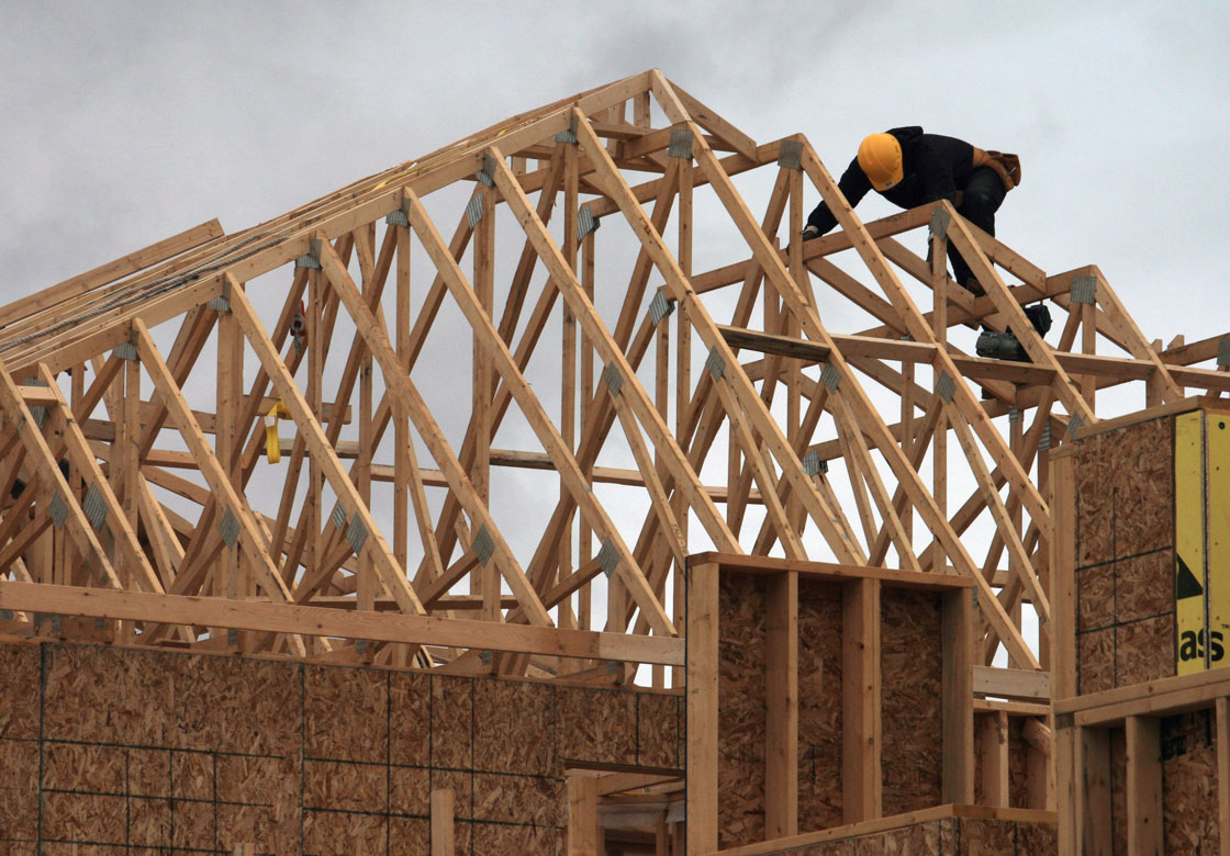 Low oil prices and an economic downturn are hurting housing construction in Calgary and Edmonton.