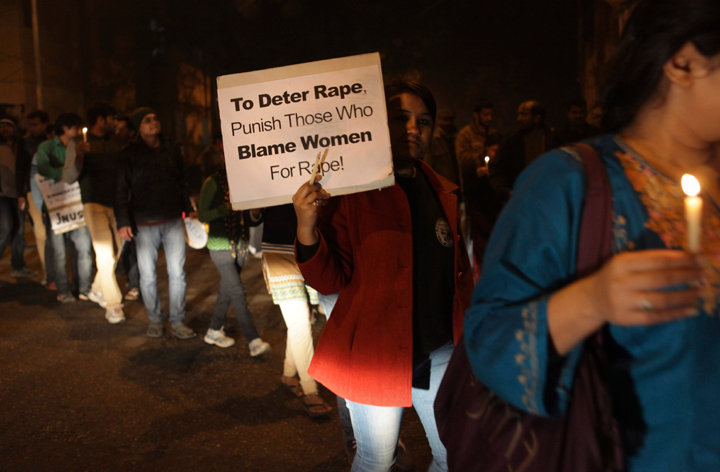 Indian students from the Jawaharlal Nehru University march during a candle light vigil on the first anniversary of the fatal gang rape of a young woman in a bus New Delhi, India, Monday, Dec. 16, 2013.