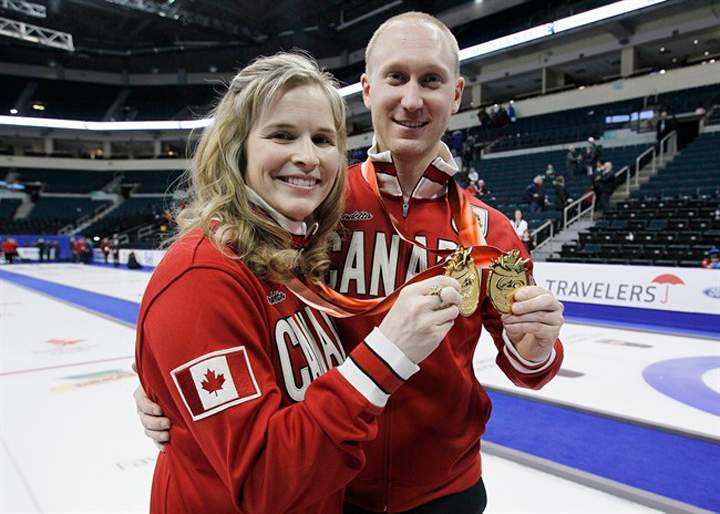 Team Canada women's and men's skips Jennifer Jones and Brad Jacobs show off their medals at the 2013 Roar of the Rings Canadian Olympic Curling Trials in Winnipeg on Dec. 8.