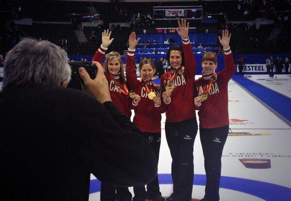 Jennifer Jones and her team from the St. Vital Curling Club pose after beating  Sherry Middaugh 8-4 Saturday night in the women's final of the Roar of the Rings Canadian Olympic curling trials at MTS Centre.