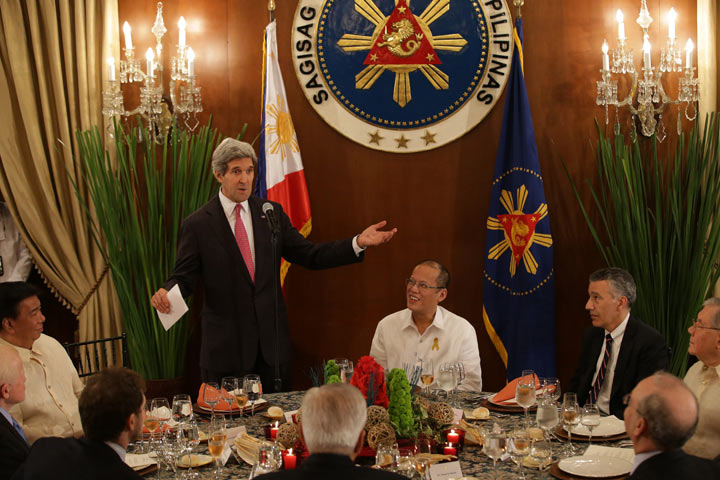 U.S. Secretary of State John Kerry, (2L) , gestures as he delivers a speech alongside Philippine President Benigno Aquino III, (C), ahead of a dinner at the Malacanang Presidential Palace in Manila on December 17, 2013.  (AARON FAVILA/AFP/Getty Images).