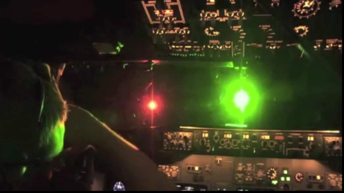 File photo of a laser being pointed at a plane.