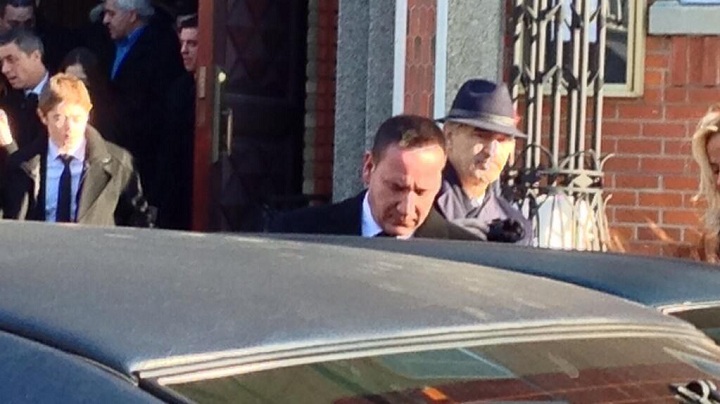 Leonardo Rizzuto steps into a waiting car after his father, Vito Rizzuto's funeral in Montreal on December 30, 2013.