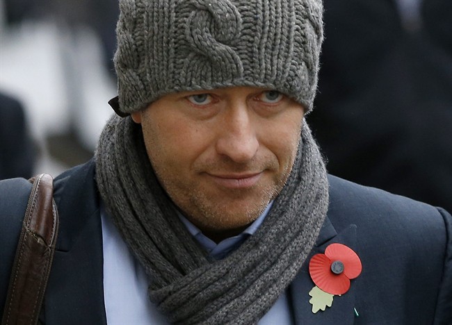 In this Thursday, Oct. 31, 2013 file photo, former News of The World news editor Ian Edmondson arrives at The Old Bailey law court in London.