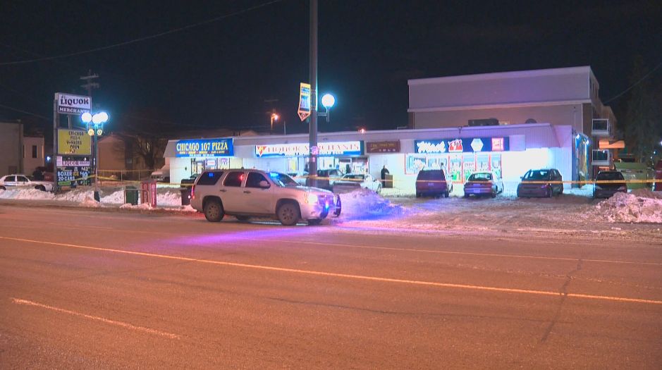 Edmonton police investigate the scene at a Mac's convenience store parking where a man was fatally stabbed, Tuesday, December 17, 2013. 