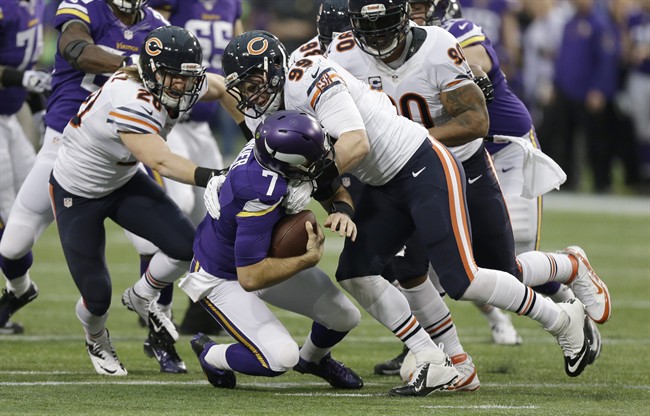 Minnesota Vikings quarterback Christian Ponder (7) is sacked by Chicago Bears defensive end Shea McClellin, right, and strong safety Craig Steltz, left.