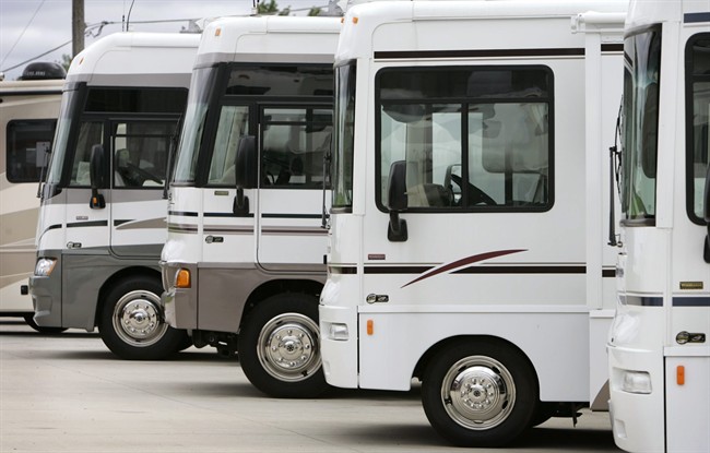 Recreational vehicles parked in lot.