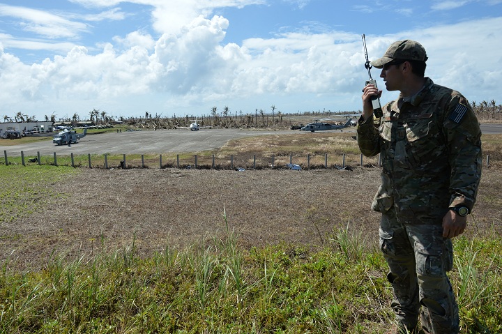 File photo - US airforce captain Jon Shamess of the 320 Special Tactics squadron based at Kadena air base in Okinawa Japan talks on his radio equipment November 16, 2013.