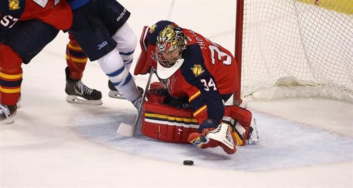 Florida Panthers goalie Tim Thomas makes a save against the Winnipeg Jets during the third period of a NHL hockey game in Sunrise, Fla., Thursday.