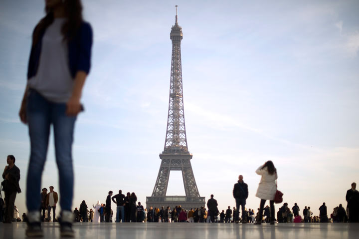 Tourists enjoy the view on November 12, 2011 at the Trocadero place near the Eiffel Tower in Paris.