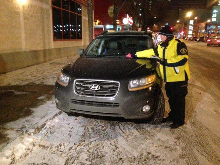 Parking enforcement officers hand out warnings rather than tickets Wednesday, Dec. 18, 2013.