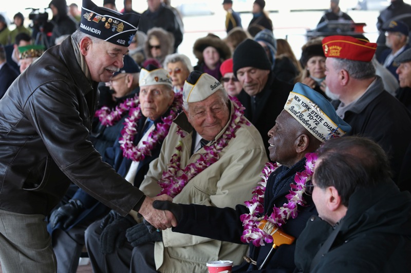  Pearl Harbor survivor Clark Simmons, 92, is congratulated after he spoke at a ceremony marking the 72nd anniversary of the attack on Pearl Harbor, Hawaii on December 7, 2013 in New York City.