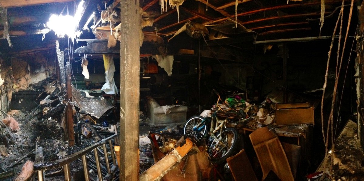 Burnt out wreckage of St. Vital garage where family's Christmas gifts were lost in a fire on Friday December 6, 2013.