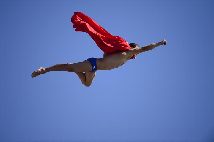 A man dressed as Superman competes at the men's high diving final competition at the FINA World Championships in Barcelona.