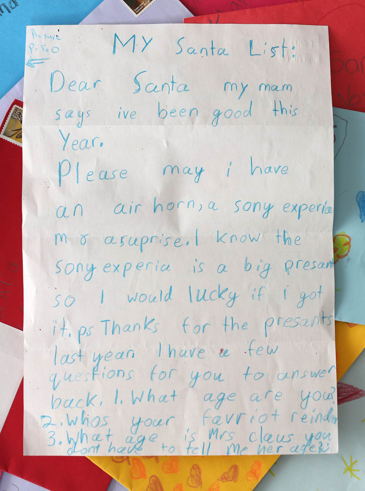“My Santa list: Dear Santa, my mam says I’ve been good this year. Please may I have an air horn, a Sony Xperia M8, a surprise. I know the Sony Xperia is a big present so I would [be] lucky if I got it. P.S. Thanks for the presents last year. I have a few questions for you to answer back. 1. What are are you? 2. Who’s your favourite reindeer? 3. What age is Mrs. Clause? You don’t have to tell me her age.”