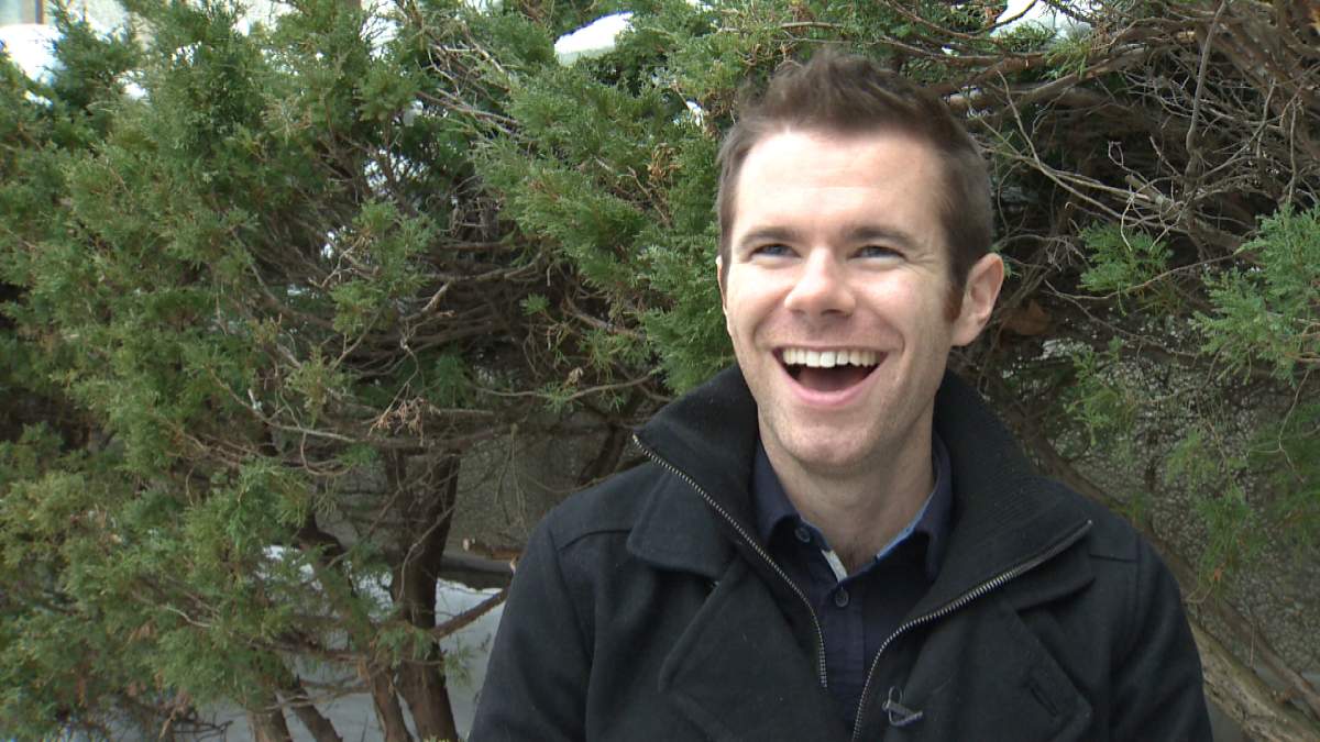Scott Jones shares a laugh during a December 2013 interview with Global News.