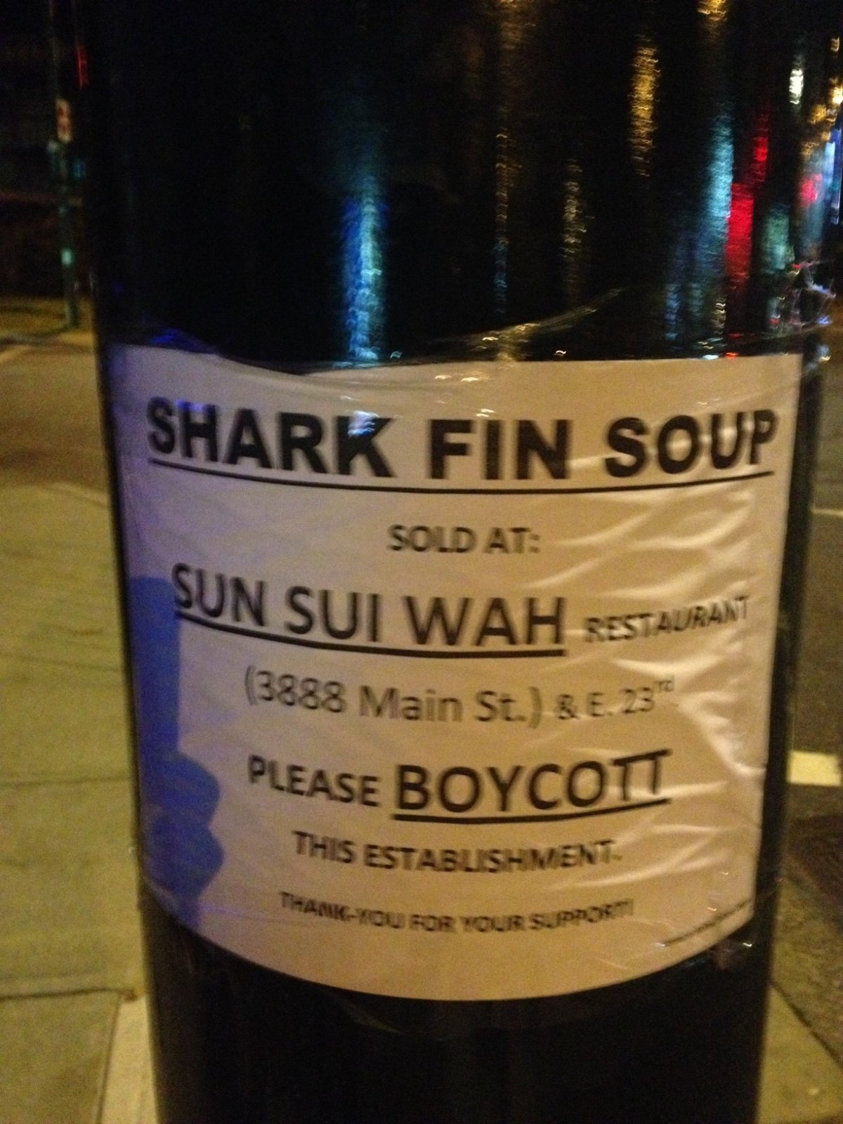 Protesters spread posters calling for boycott of well-known Chinese restaurant serving shark fin soup - image