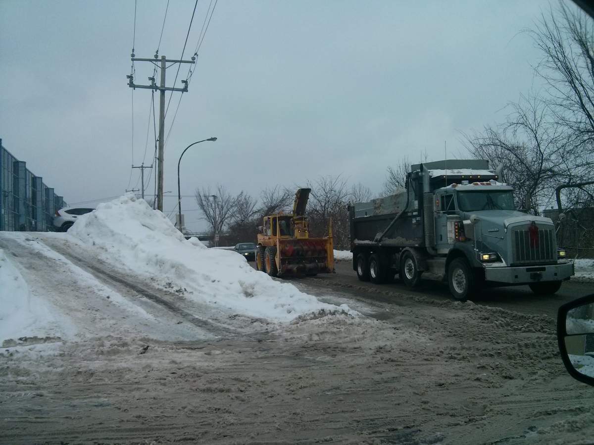 This snow removal team in Lachine had its hands full Friday.
