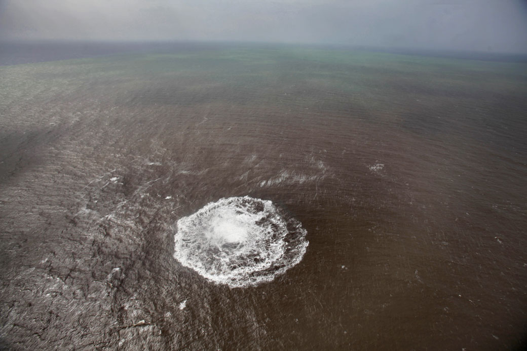 Aerial view taken on October 17, 2011 of a green and brown stain at sea off the coast of the village of La Restinga on the Spanish Canary Island of El Hierro.