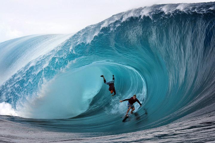 Garrett McNamara (L) and US Mark Healey compete during a free session of surf tow-in, in the southern Pacific ocean island of Tahiti, French Polynesia, on June 1, 2013.  (Gregory Boissy/AFP/Getty Images)
.