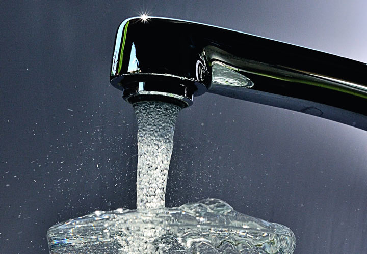 File: Tap water fills a glass.
