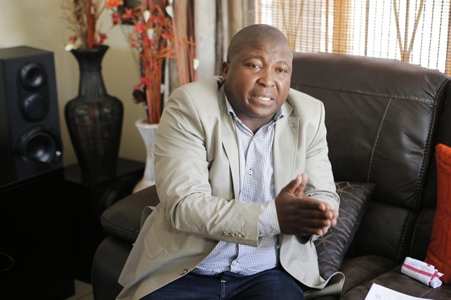 Thamsanqa Jantjie gestures at his home during an interview with the Associated Press in Johannesburg, South Africa,Thursday, Dec. 12, 2013. 