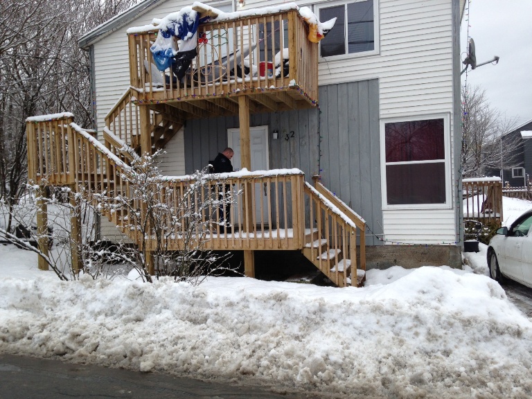 Police canvass the neighbourhood for witnesses.