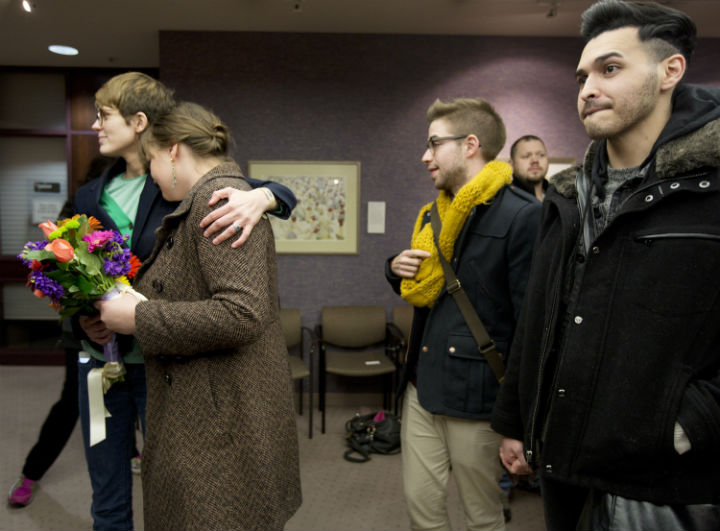 Same-sex couples wait in line to get a marriage license at the Salt Lake County Clerk's Office in Salt Lake City.